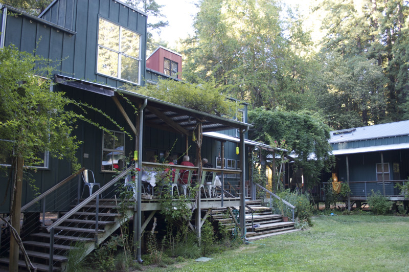 Wide covered porches of the Common House accommodate outdoor dining and chairs for conversation, and broad steps cascading down to the lawn make ideal seating for grandchildrens talent shows.